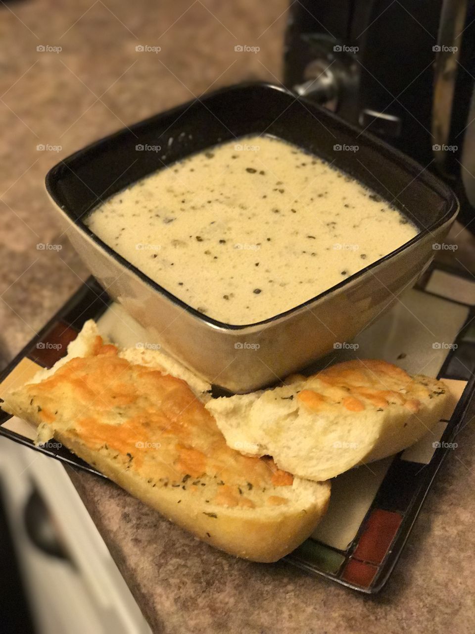 Clam and corn chowder with garlic bread and cheese 
