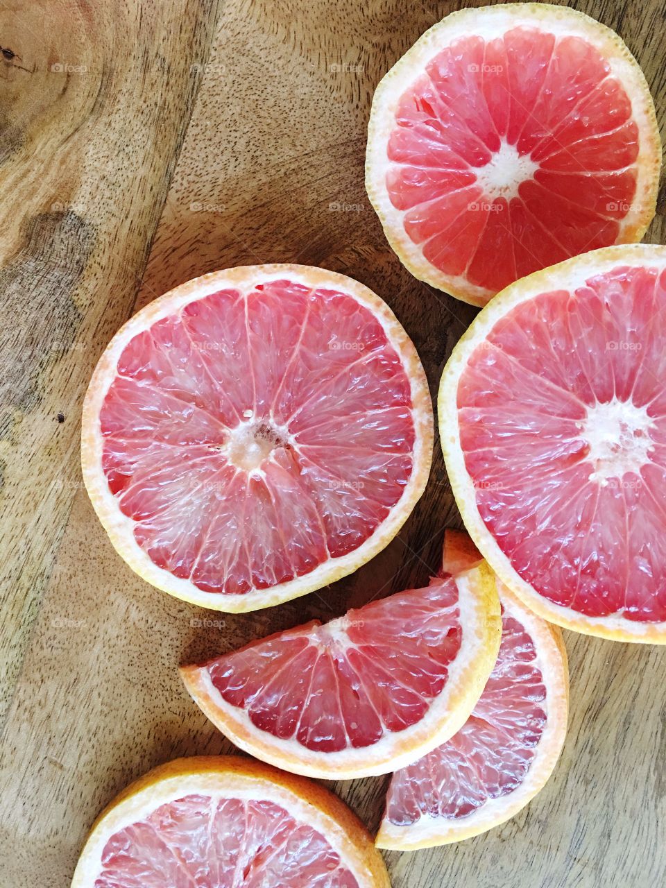 Fresh, juicy pink grapefruit slices.