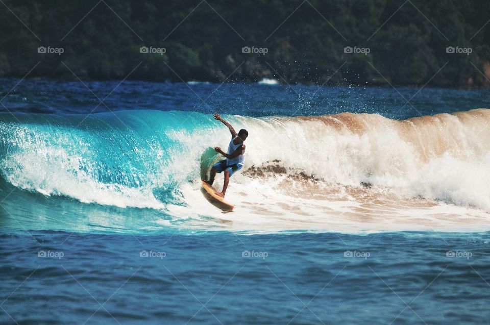 Man surfing on sea wave