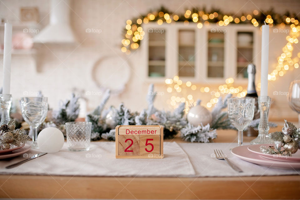 Christmas background with wooden block calendar with the date of December 25