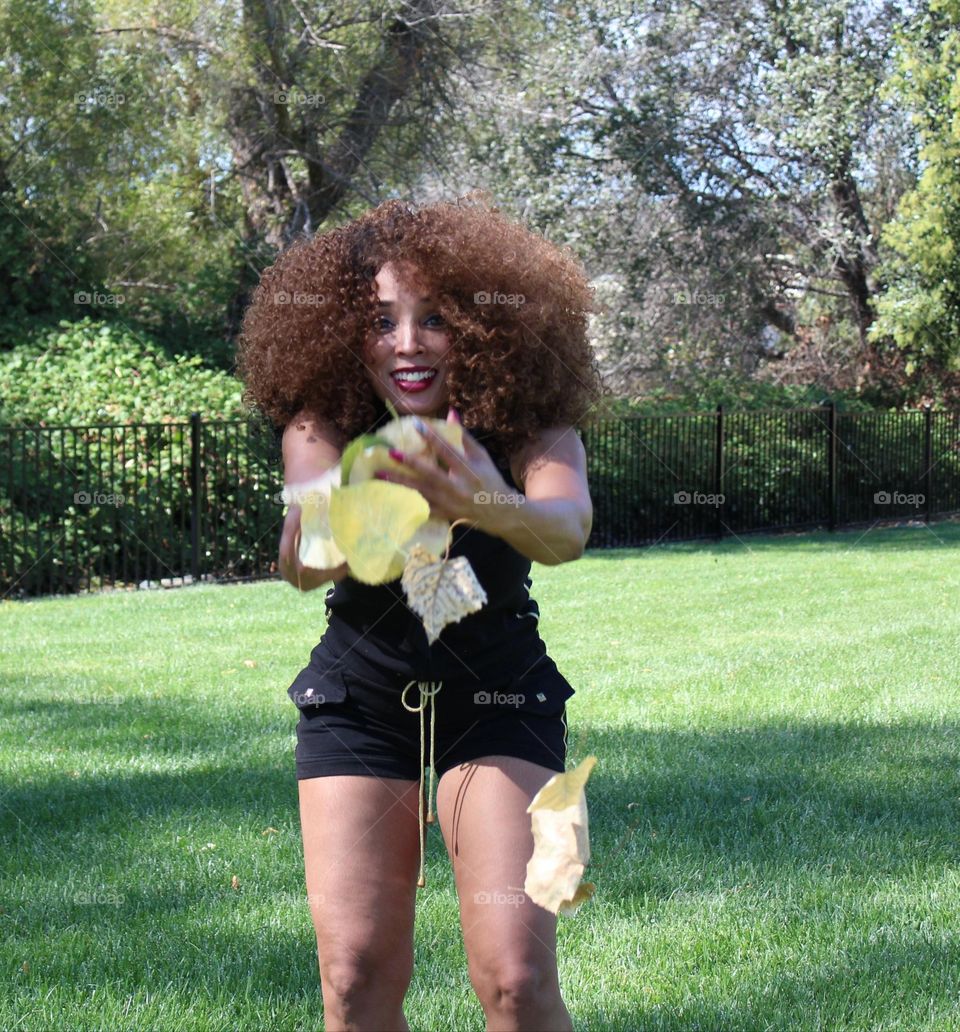 playing with nature on a beautiful  sunny day at the park