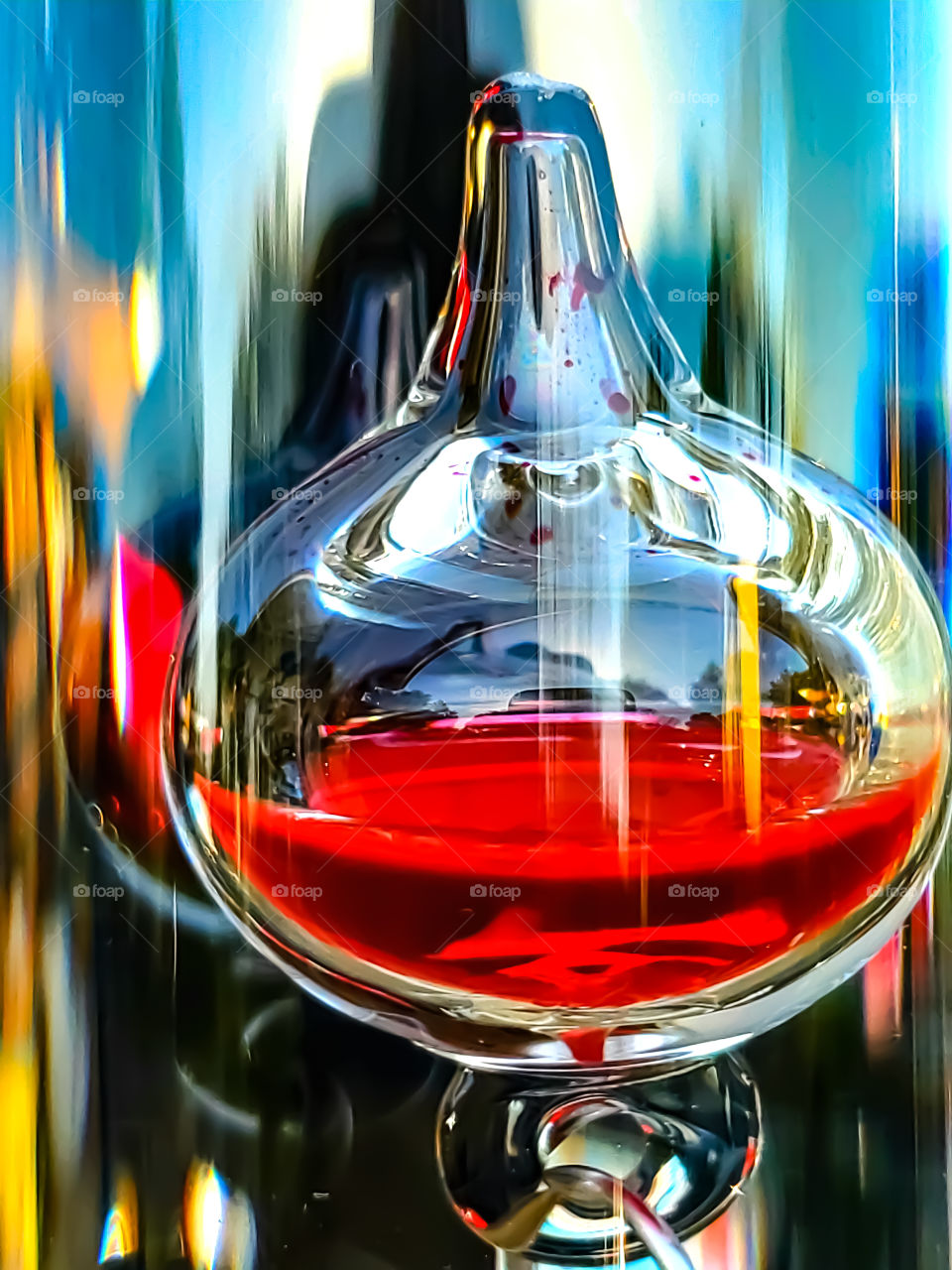 Abstract:  Closeup colorful reflections on a Galileo thermometer