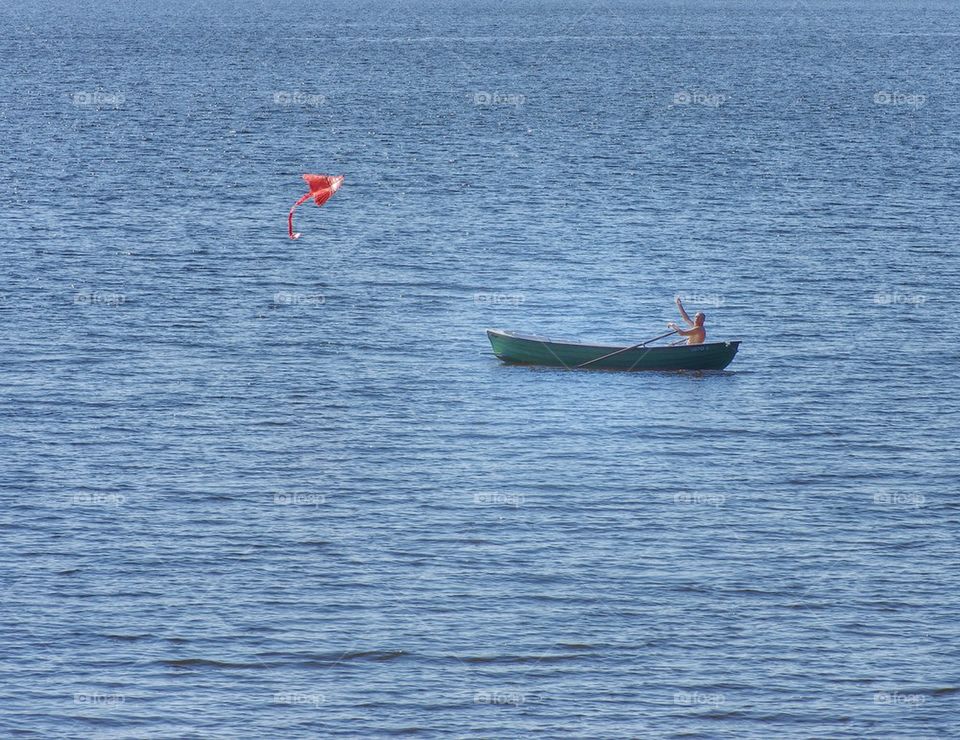 Flying a kite. 