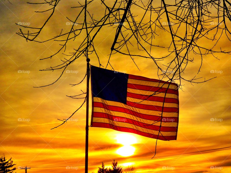 Sunset behind the USA flag