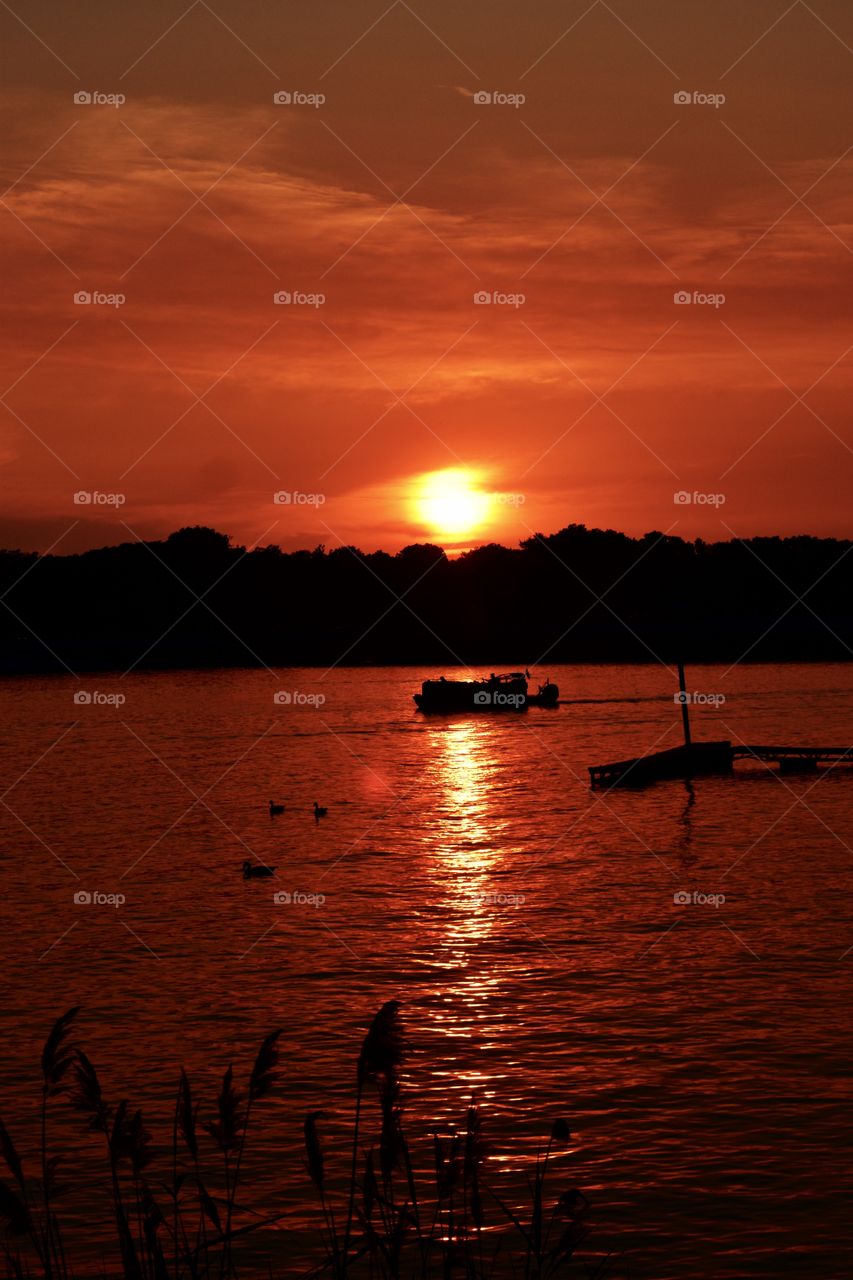 Sunset on a lake and a boat