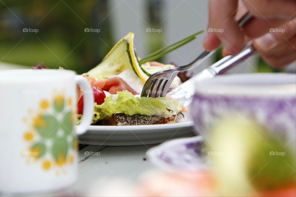 Sandwich in the summer. Eating a sandwich on a hot summer day