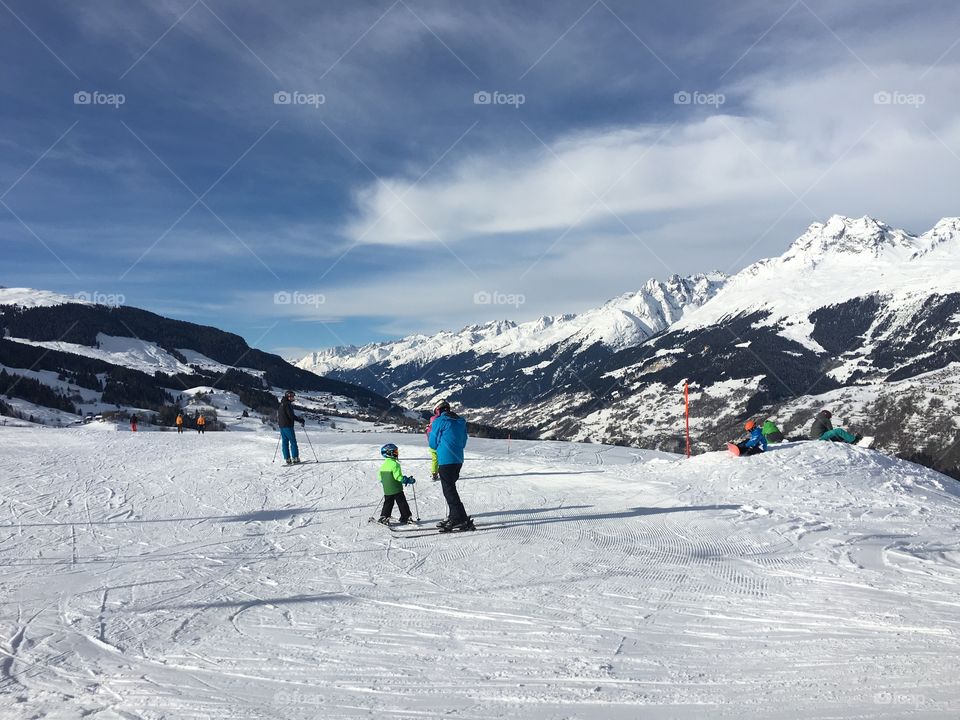 Family enjoying ski king in winter season