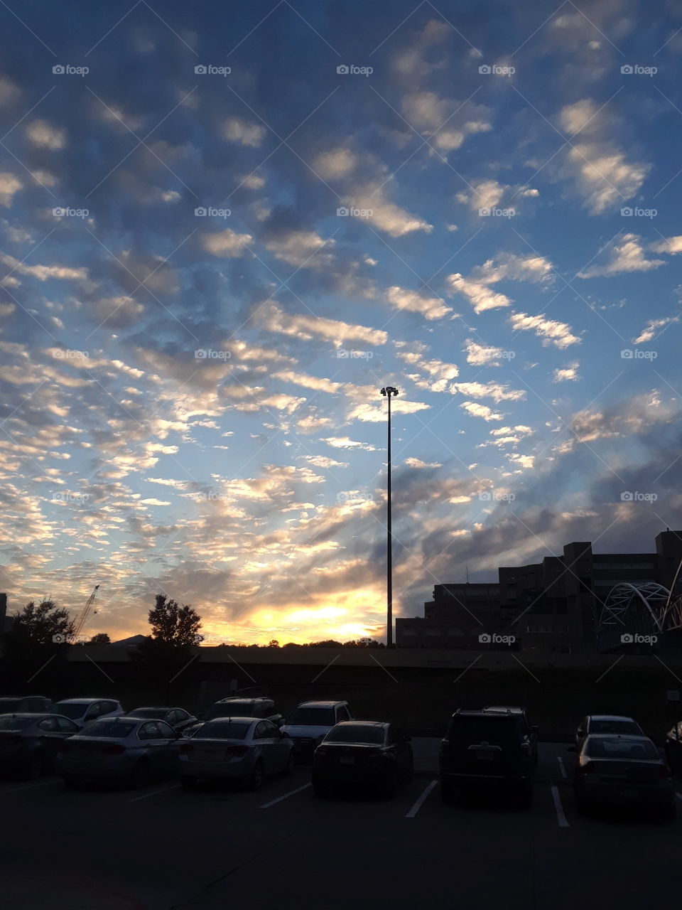 Beautiful sunset over a college parking lot in the middle of fall