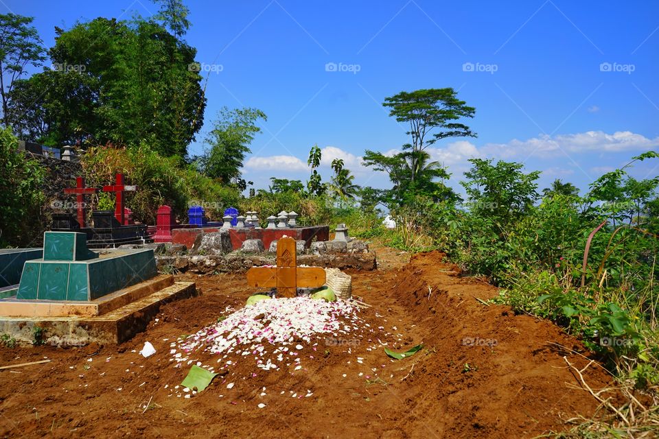 cemetery after the funeral procession in a javanese village of Indonesia