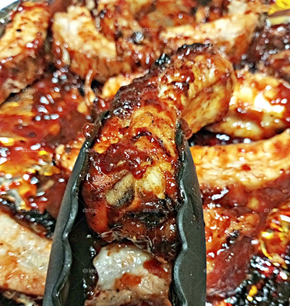 oven cooked BBQ ribs, cooked on each side for 20 minutes at 400 degrees Dane Cook for a 45 minutes at 300 degrees. seasoned with special dry seasoning for 4 hours then marinated for 2 hours with beer, liquid smoke, olive oil and canola oil