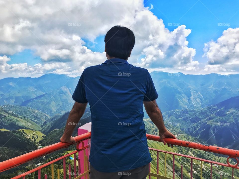 A man admiring the mountains