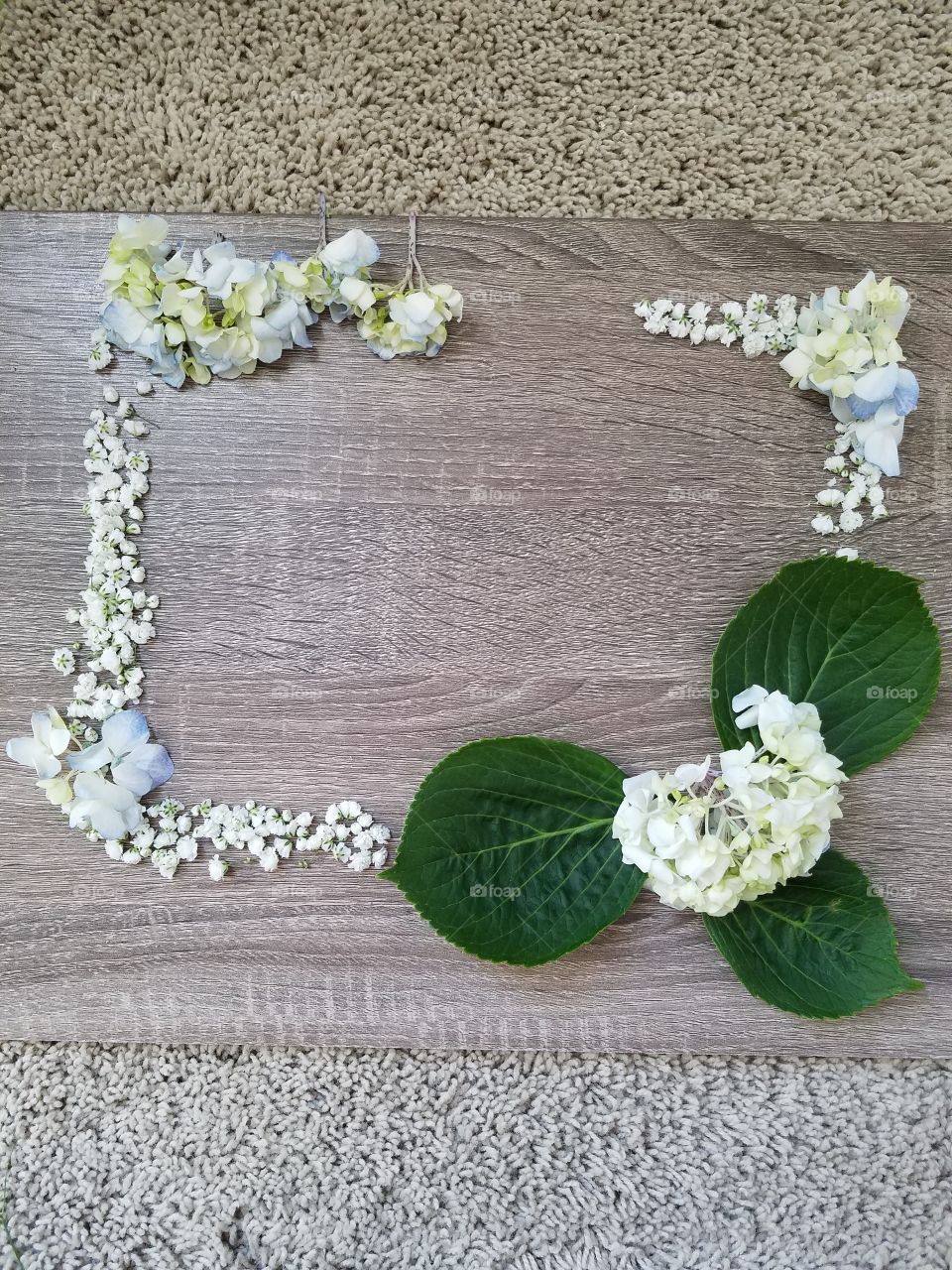 floral spring flat lay on a rustic wooden table