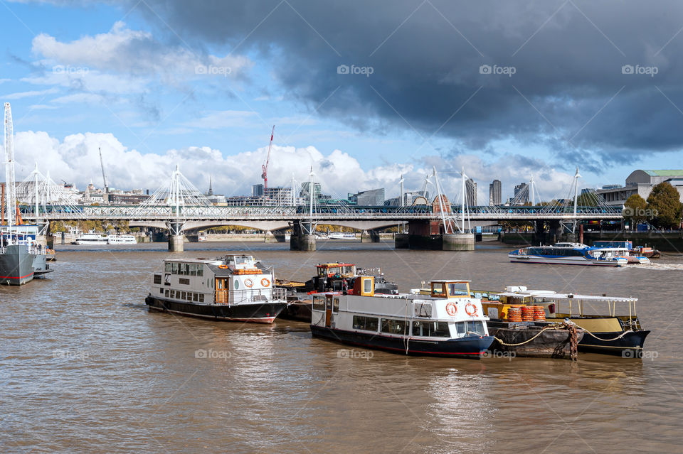 Thames River with small ferry boats. London. UK.