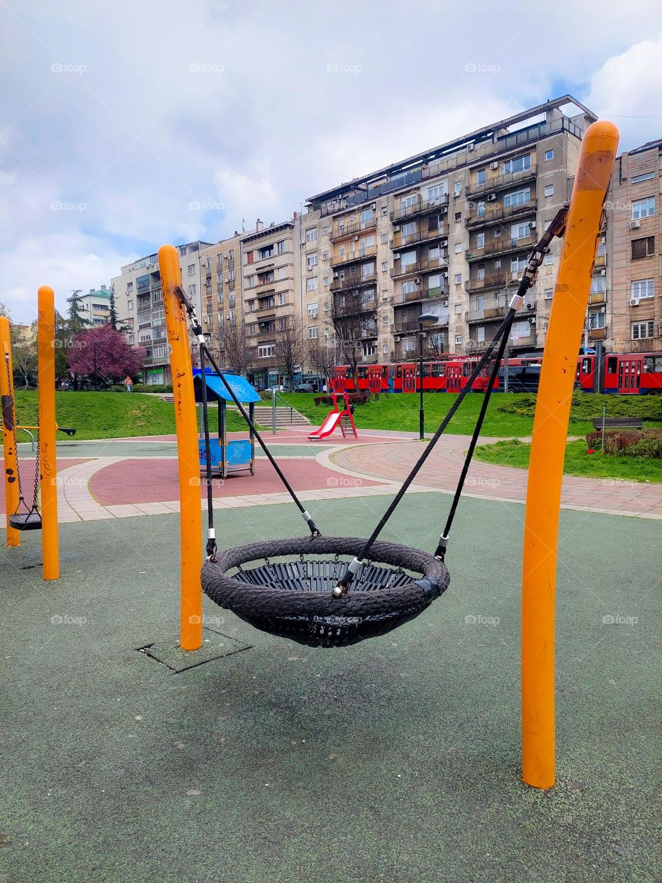 City landscape.  Children's playground with equipment for children.  Dominance geometric shapes:circle,  triangle, and rectangle