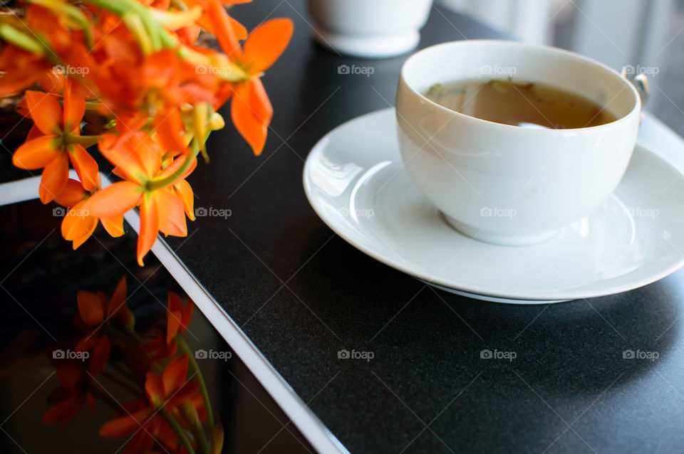 Tea cup with digital tablet