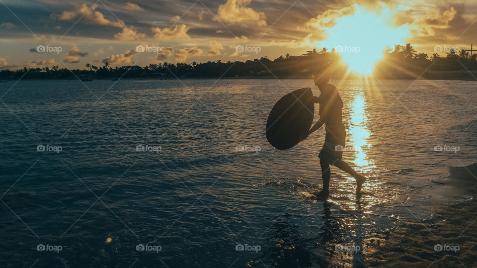 enjoying the beach in the sun and playing a board