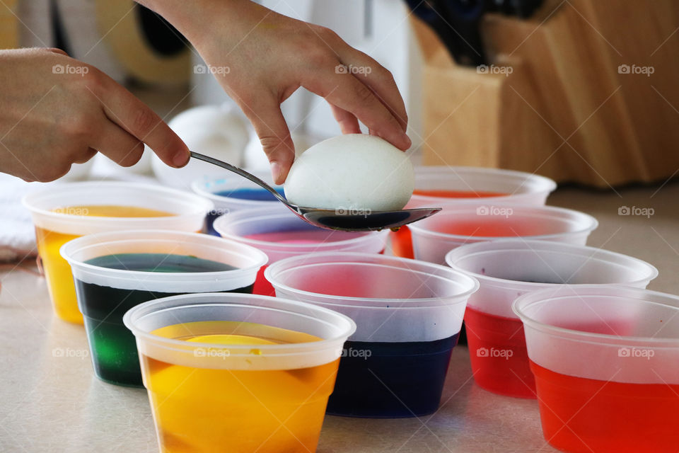 Child dye eggs for Easter