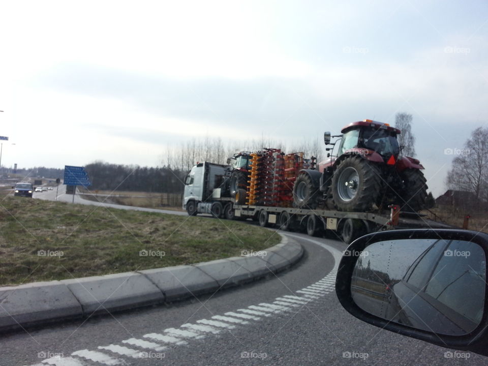 Tractor on truck 