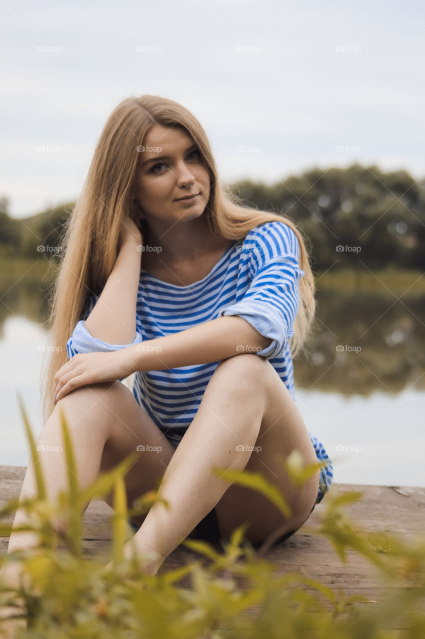 A girl with blond hair on the lake in a striped shirt and short denim shorts on the background of grass, reeds and an old wooden boat
Girl, woman, people, blonde, blonde hair, striped shirt, short shorts, denim shorts, shore, lake, grass, reeds, old boat, feelings, emotions, tenderness, love, lifestyle, lifestyle, vacation