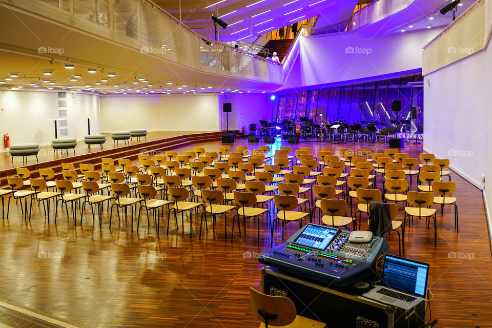concert hall before concert, empty chairs, musical instruments and sound board waiting for the audience