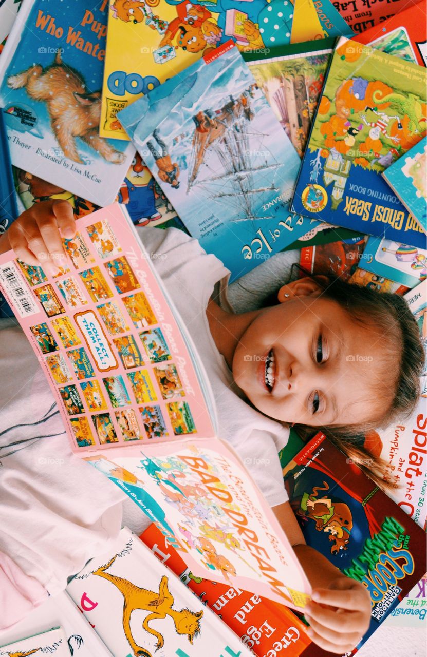 Girl reading story books