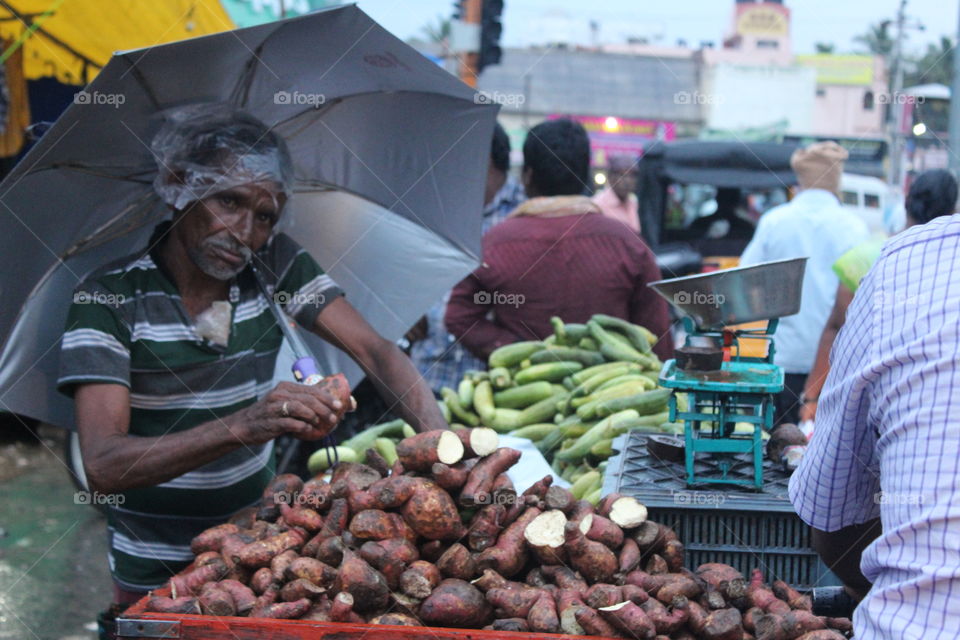 daily market,rain,poor, business, Street business,market, umbrella,local, poverty, engaged,smile,