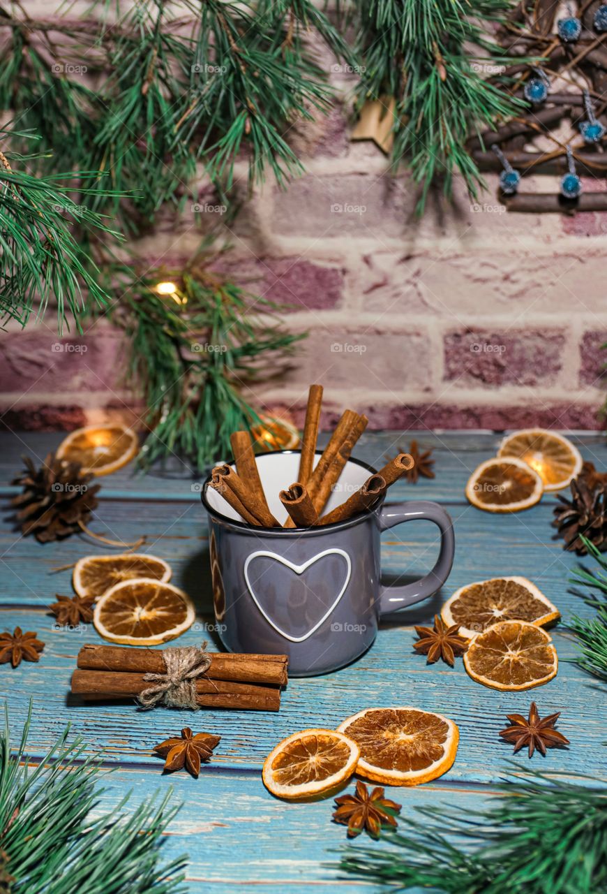 Christmas decorations of dried oranges on a wooden table