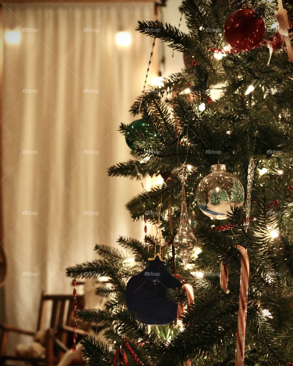 Christmas tree filled with ornaments decorated for the holiday.