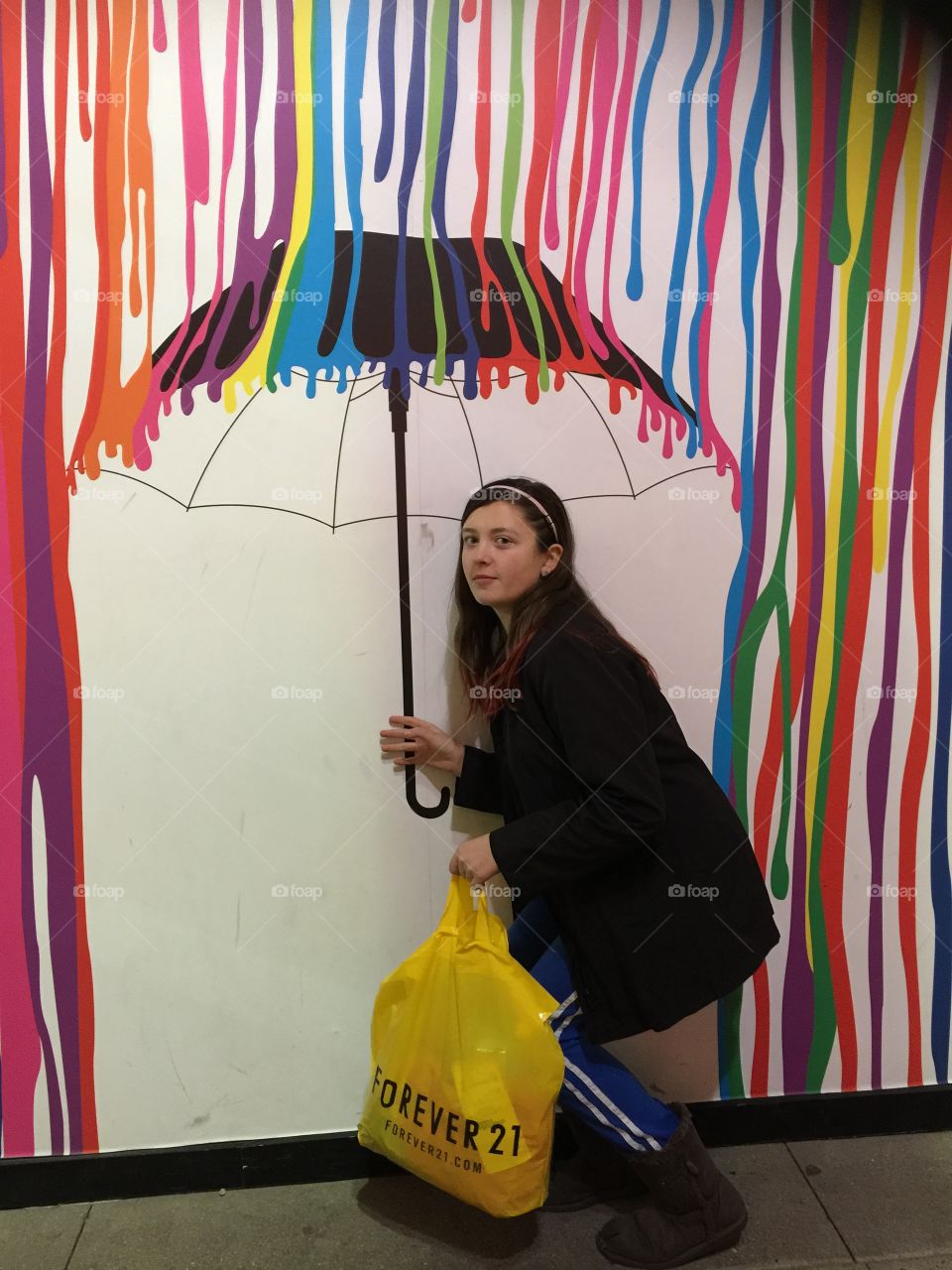 Woman holding umbrella in painting