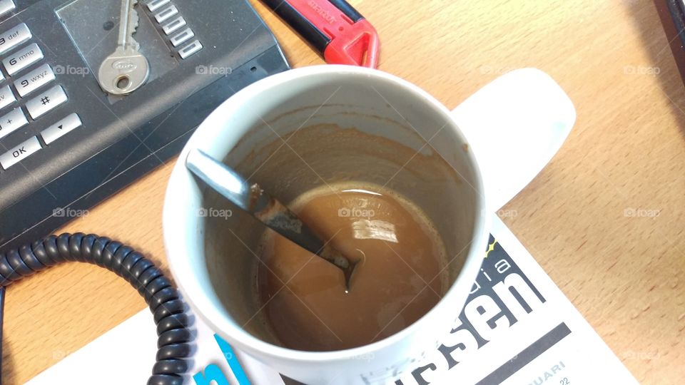 Almost empty coffee mug