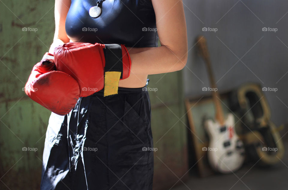 Box training, boxing gloves on woman's hands