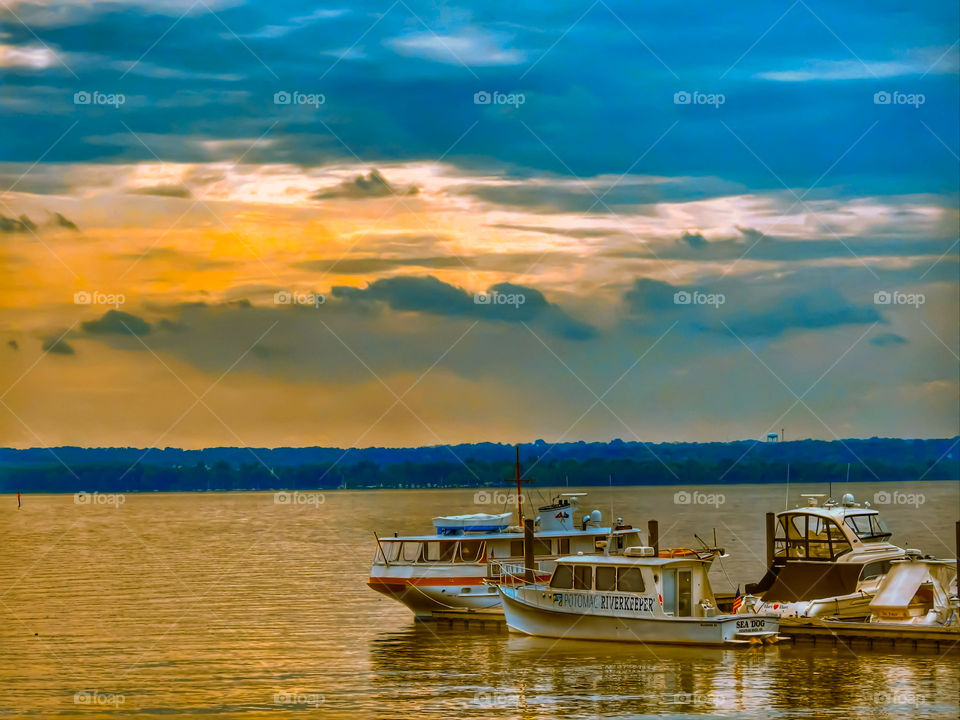 Boats In The Potomac River In Maryland Under The Sunset Sky
