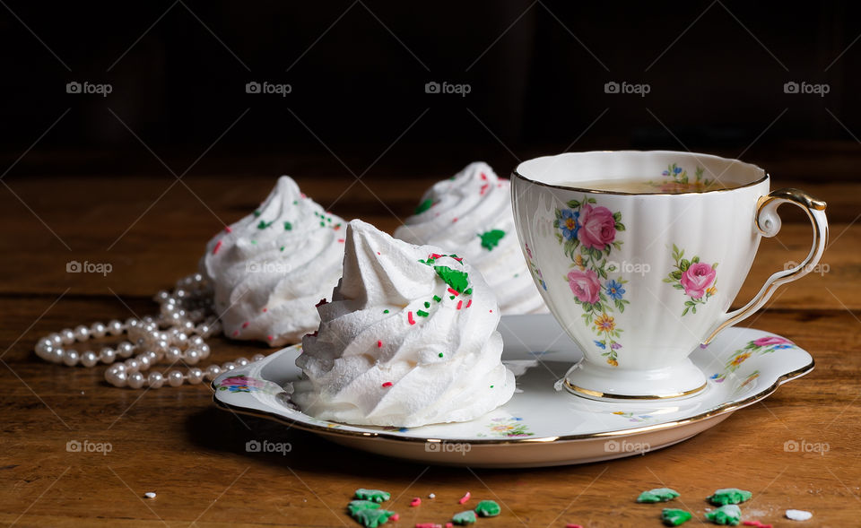 a porcelain cup of tea and marshmallows
