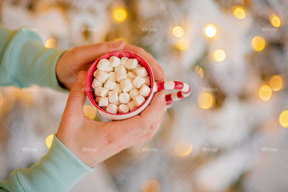 cup of coffee in a cozy festive Christmas atmosphere