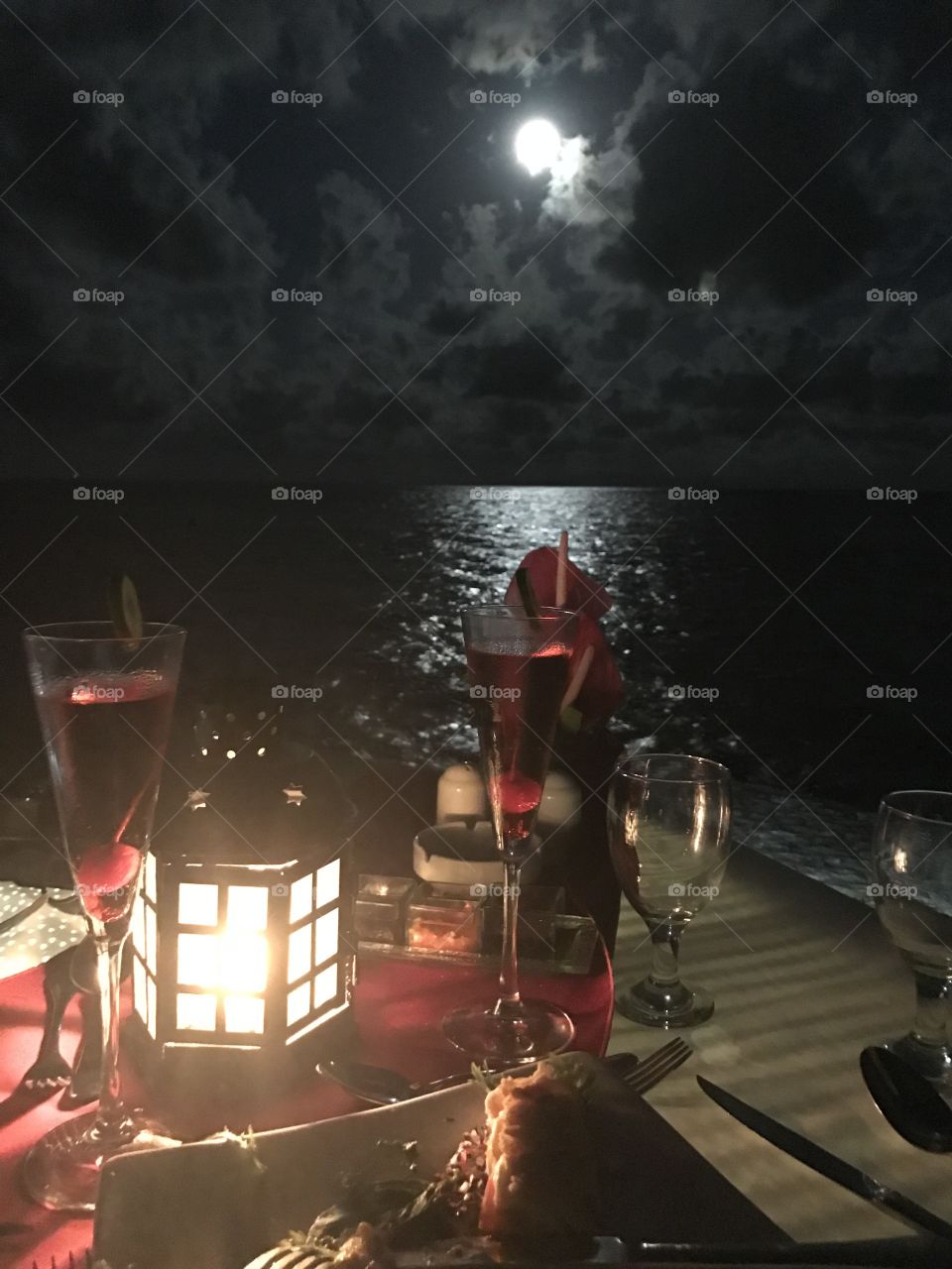Meal on the pier by moonlight