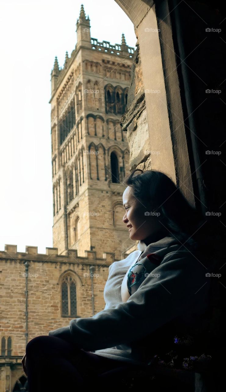 Lady smiling from the window