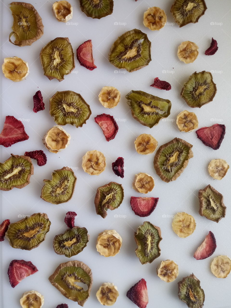 dried strawberries, dried bananas, and dried kiwi flatlay