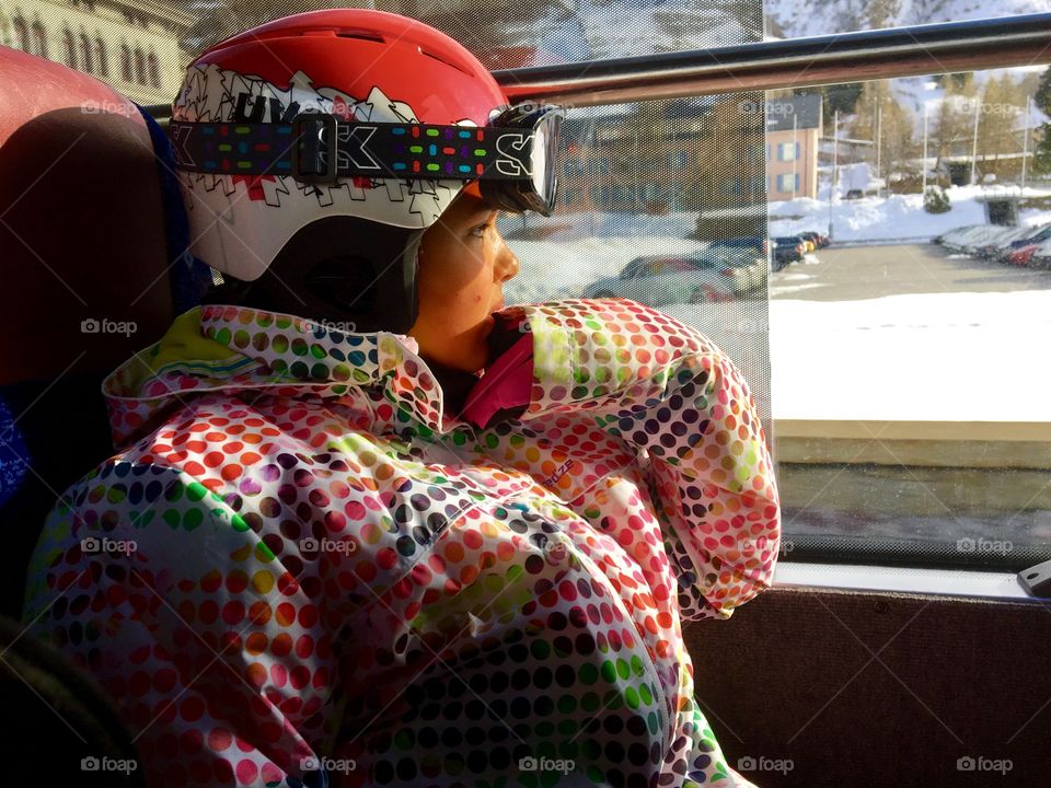 Skier looking out from window