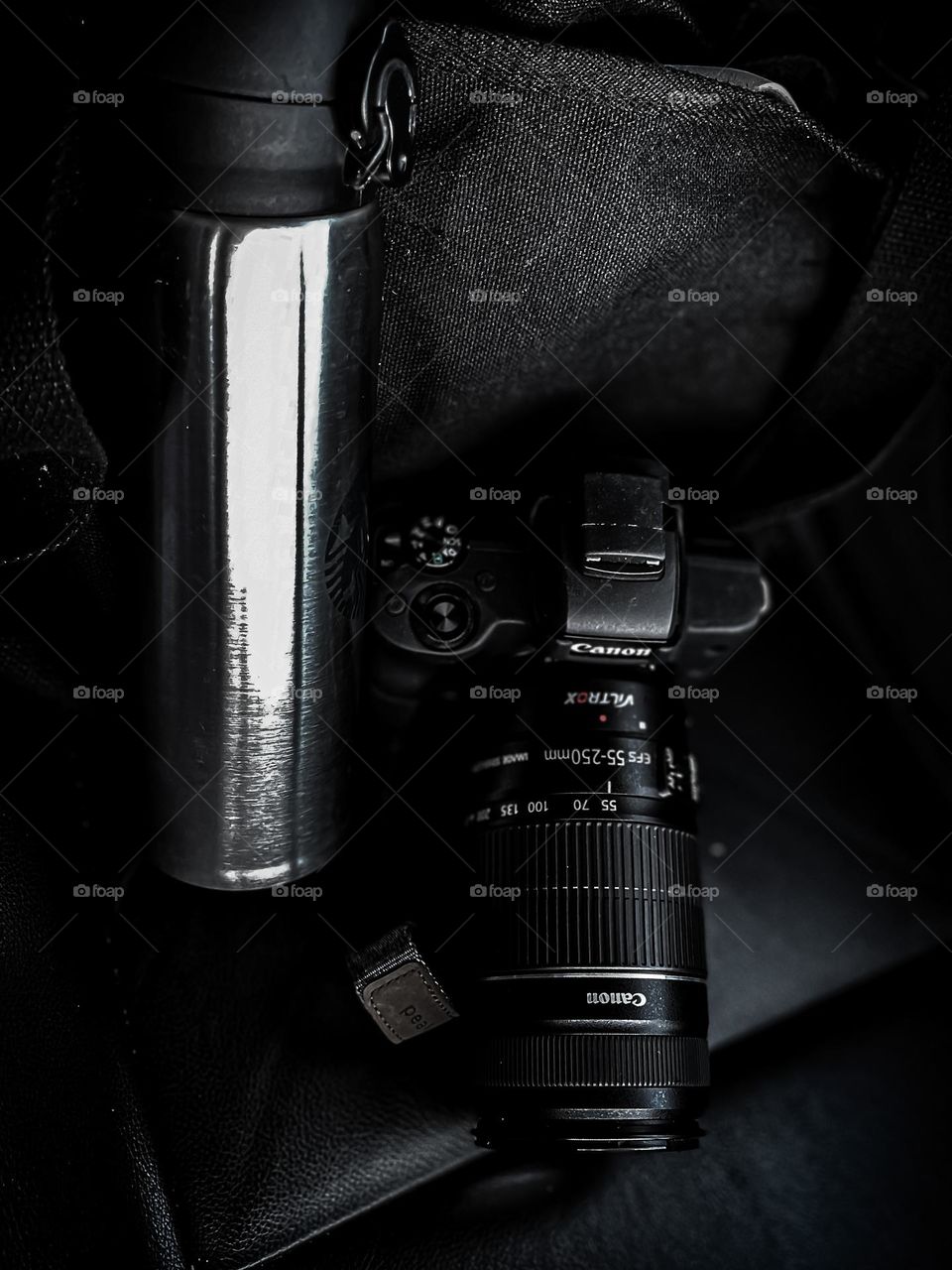 Travelling with a camera and a tumbler of hot coffee for the holiday journey