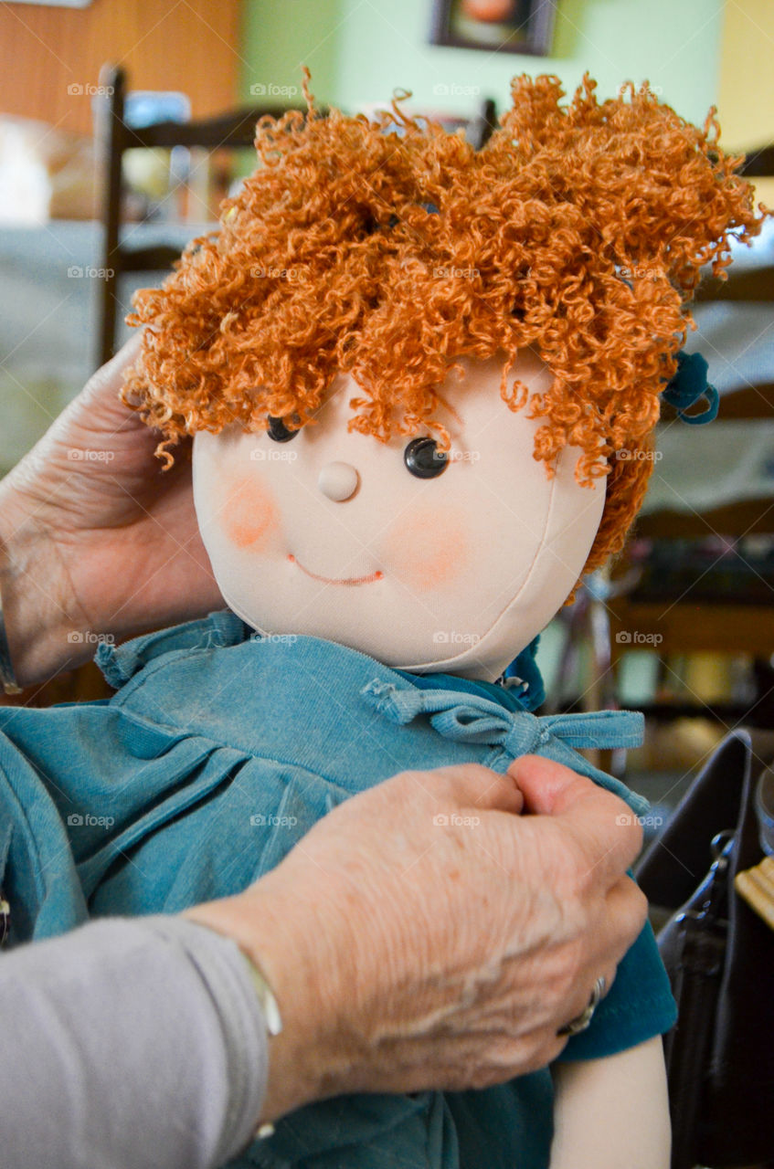 A woman making a doll