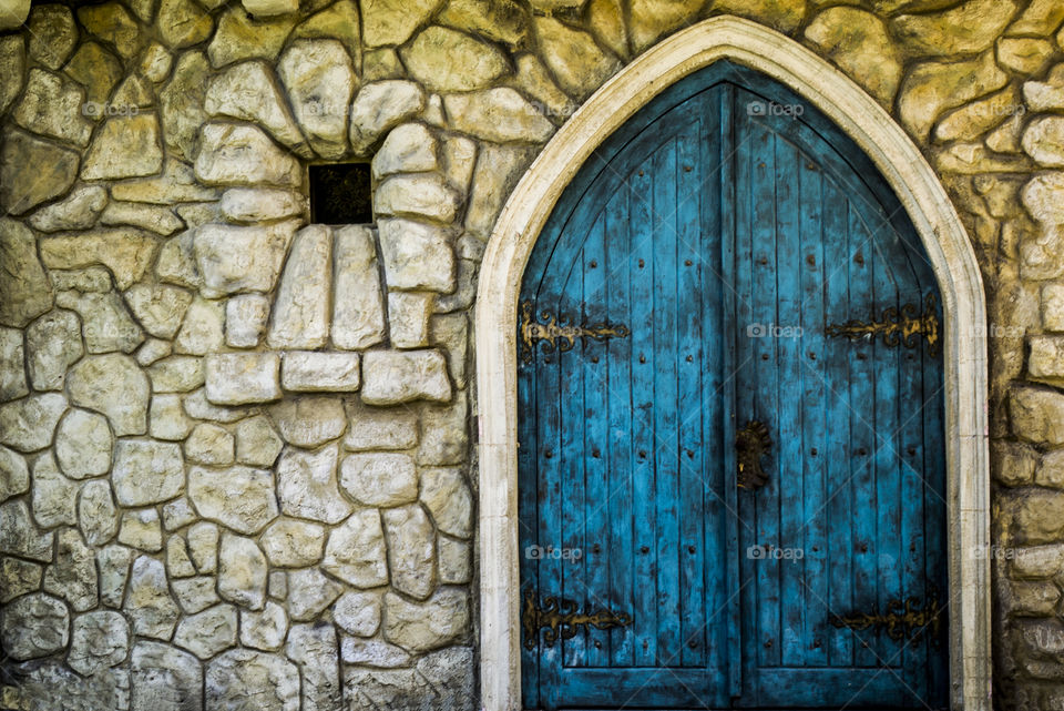 Large blue wooden castle door