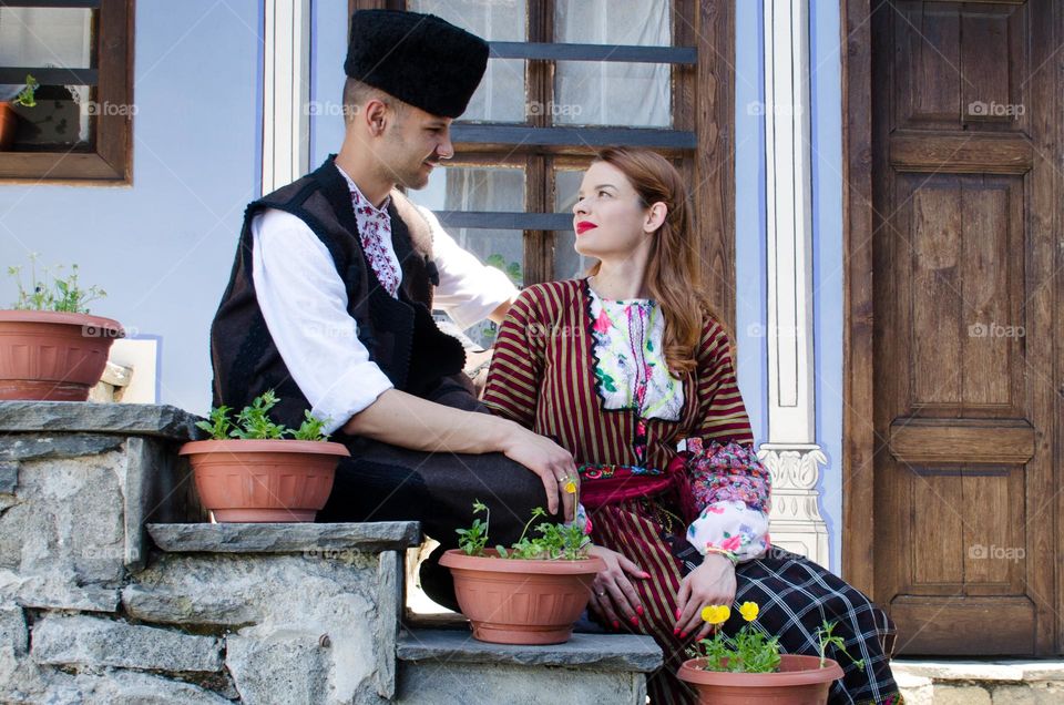 Tenderness Series:Beautiful Happy Couple Young Husband Wife, Dressed in Bulgarian Traditional Clothing (nosiya)