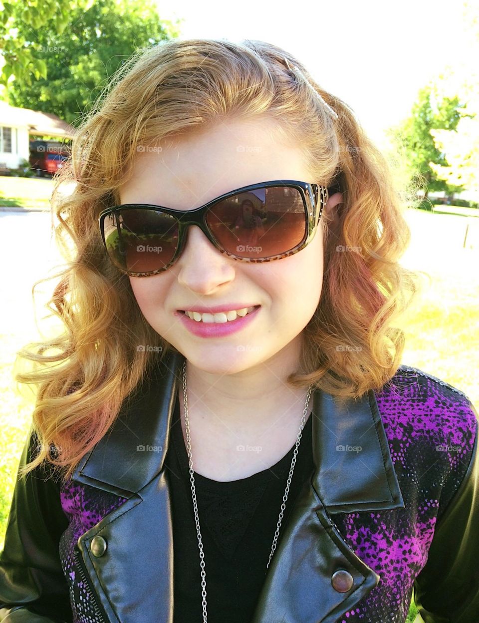 Lil’ poser, sporting her Mal jacket and sunglasses for school. 