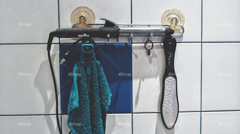 face towel, curling iron and bathroom accessories