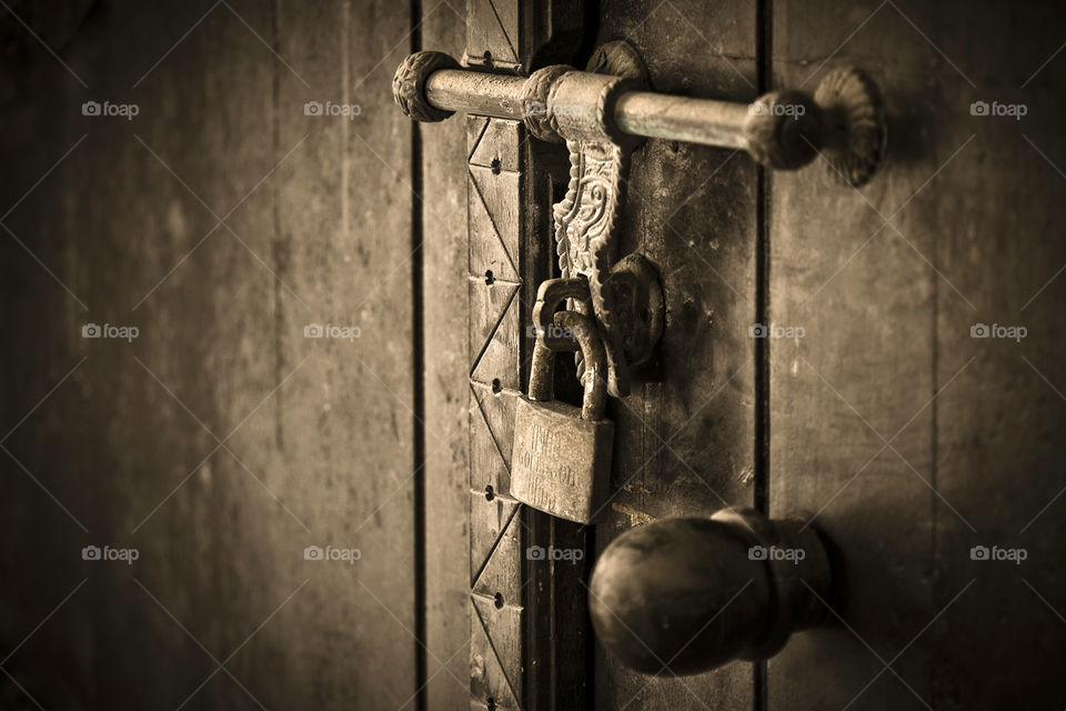 An old wooden door with a lock