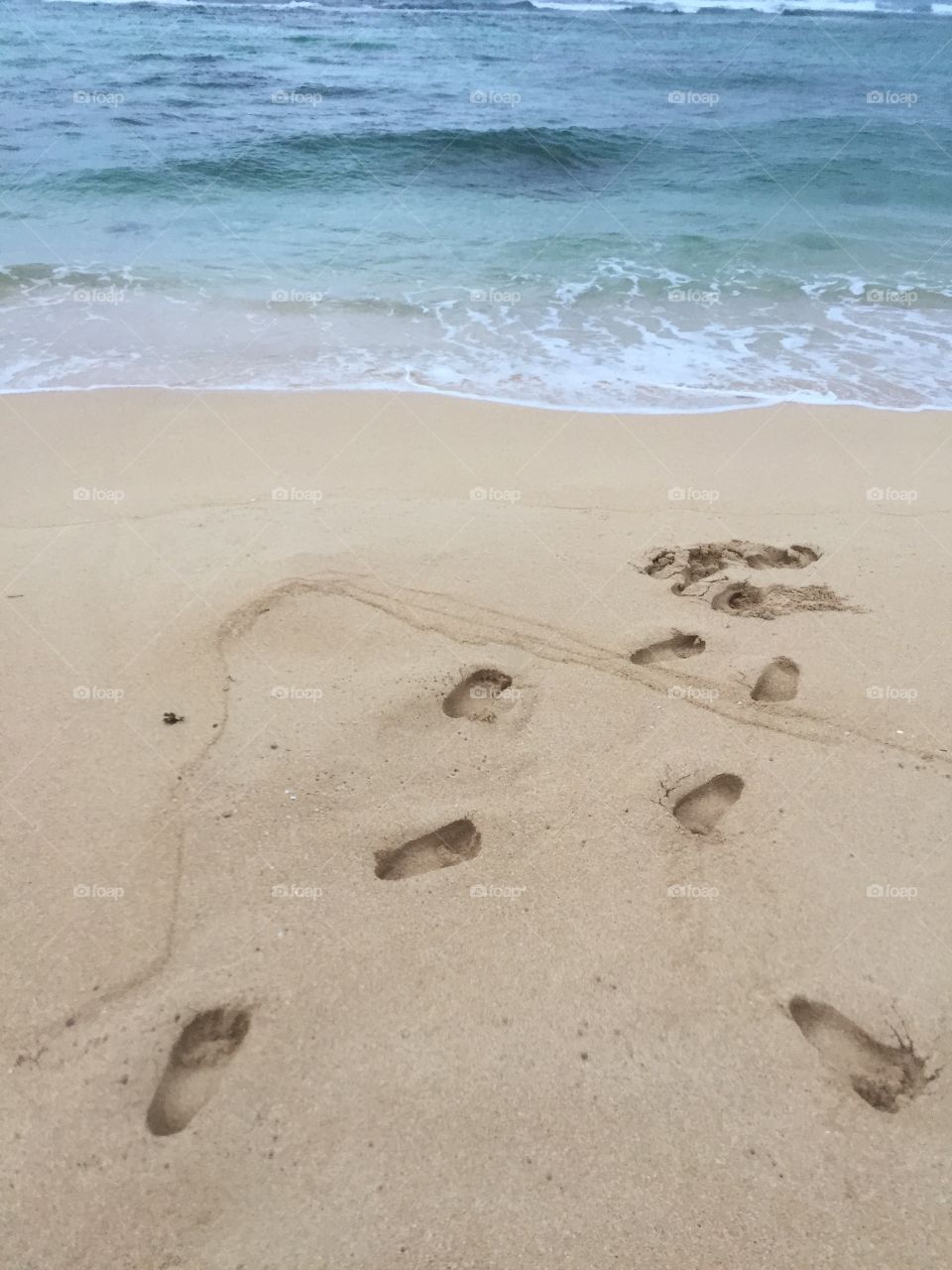 Footprints by the sea