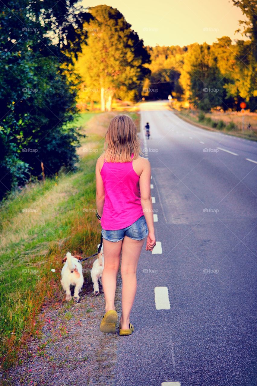 Walking. Family taking a walk with their dogs