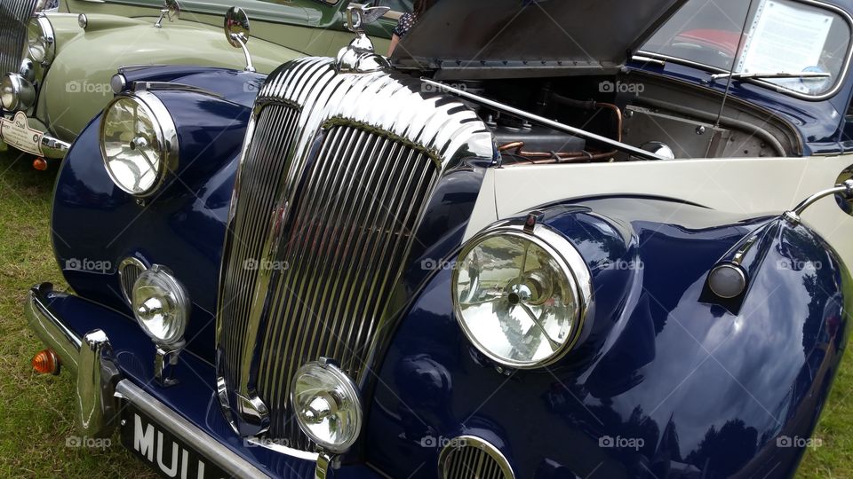 vintage bentley car in blue and chrome
