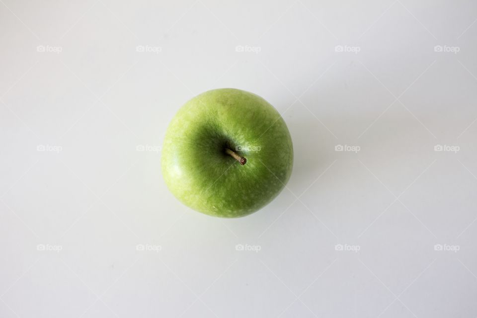 Colorful green apple on white background 