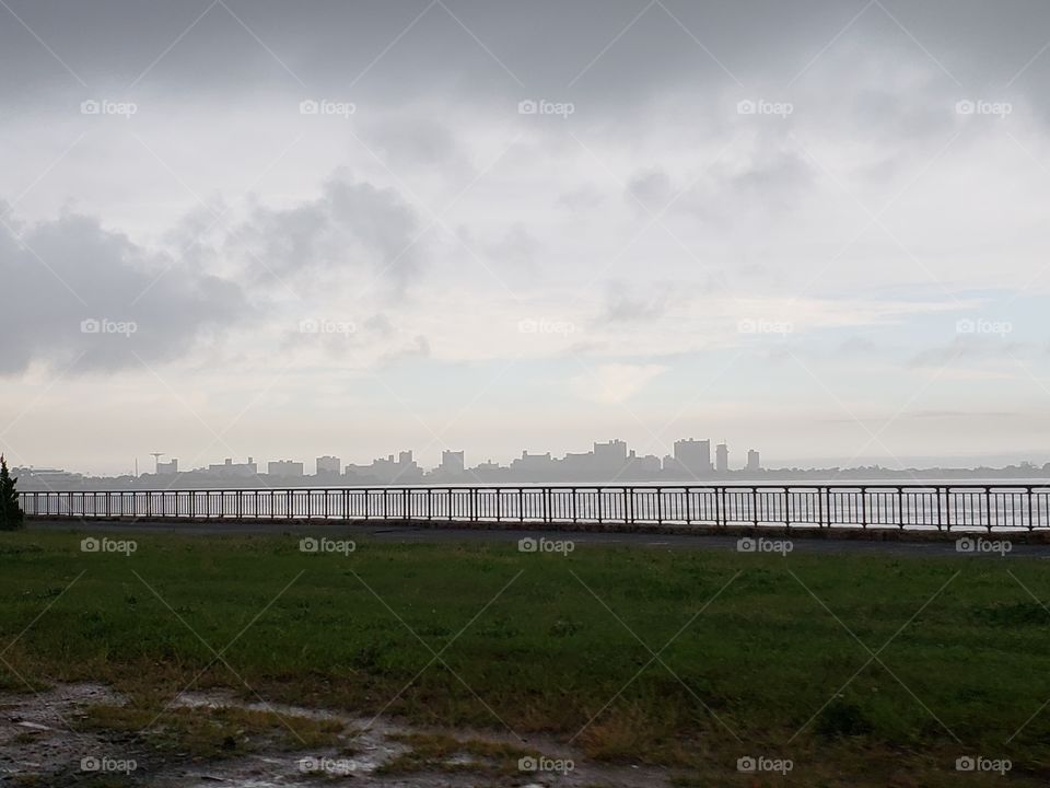 Silhouette of city during storm